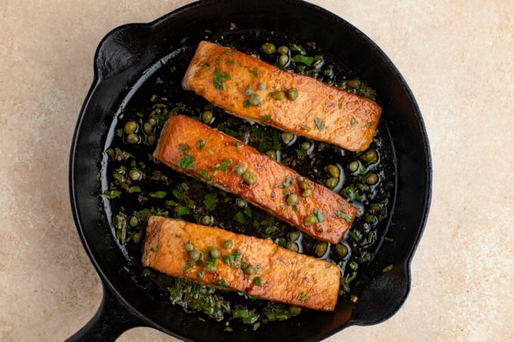Salmon meuniere with capers in cast iron skillet