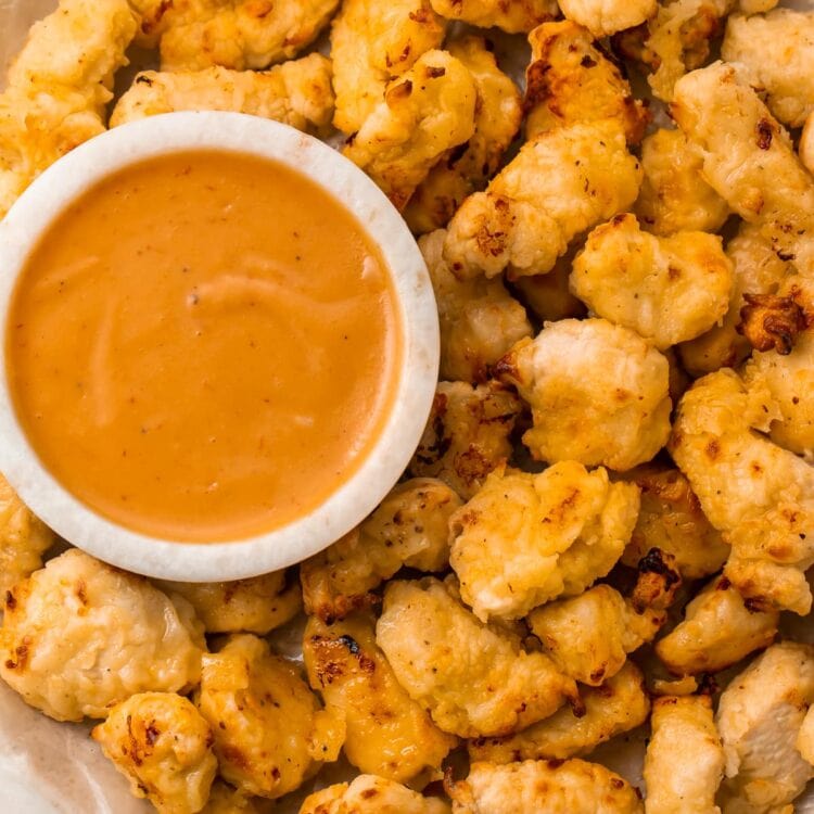 Air fryer chicken nuggets next to a bowl of Chick-fil-a sauce
