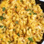 Overhead view of buffalo chicken mac and cheese in a cast iron skillet