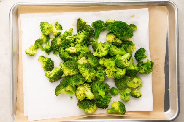 Fresh broccoli after cooking and drying, laying on a paper towel