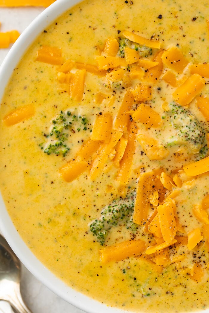 Close up of keto broccoli cheese soup in a white bowl