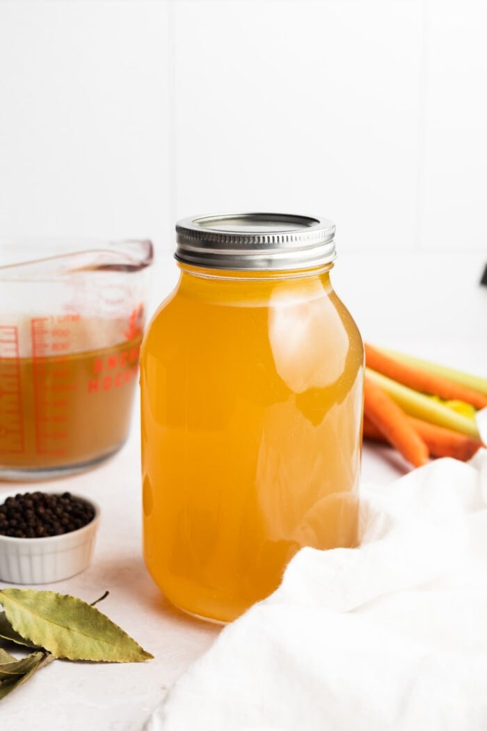 instant pot chicken stock in a jar on the counter