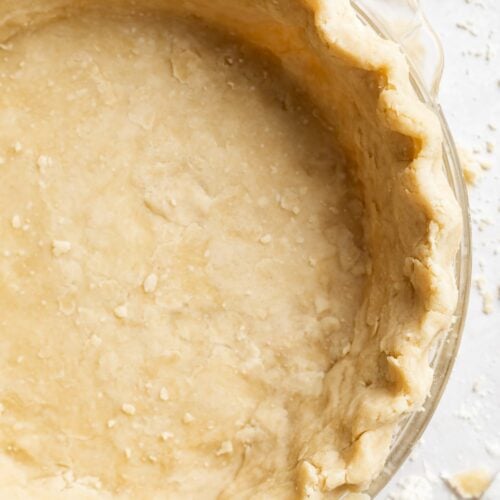 overhead image of vegan pie crust in a pie dish