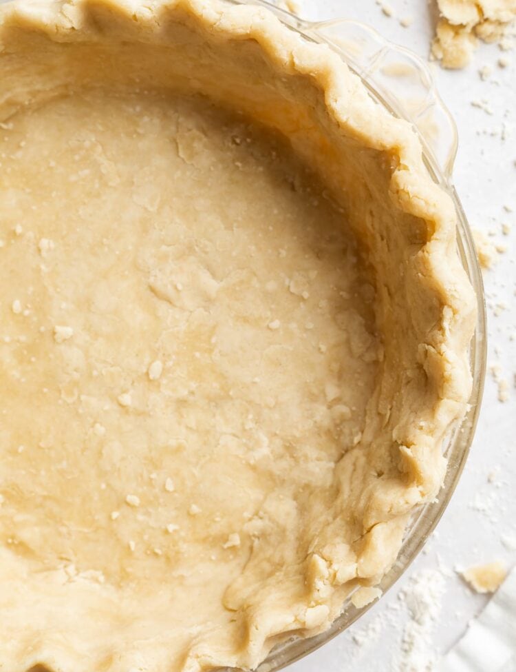 overhead image of vegan pie crust in a pie dish