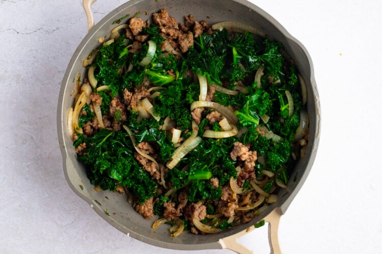Kale and sausage in large skillet