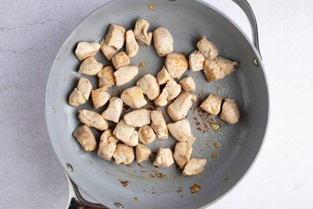 Chicken breast pieces in large skillet
