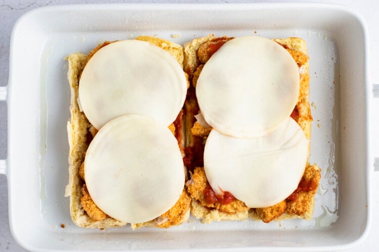 Provolone cheese over chicken strips for chicken parm sliders