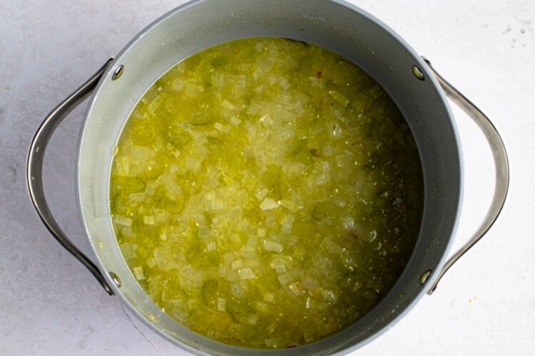 Chicken broth and celery in large pot