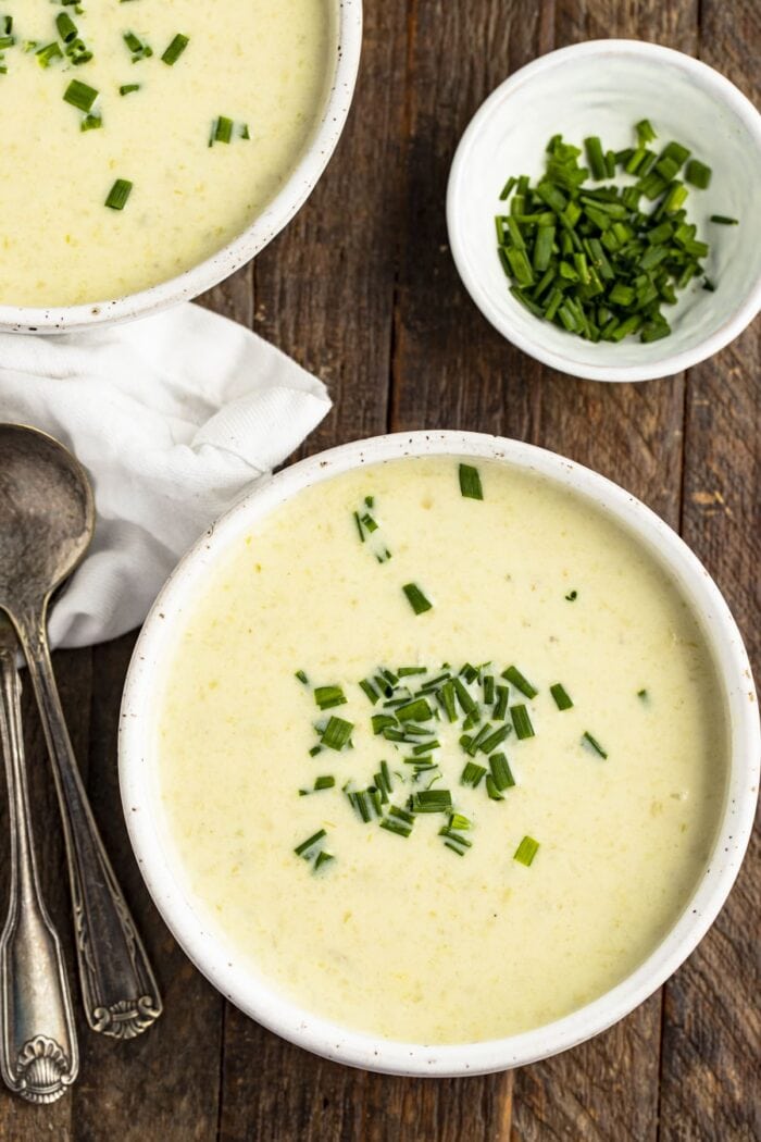 Overhead view of a bowl of cream of celery soup