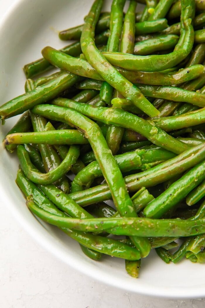 Closeup of Instant Pot green beans in a large white bowl
