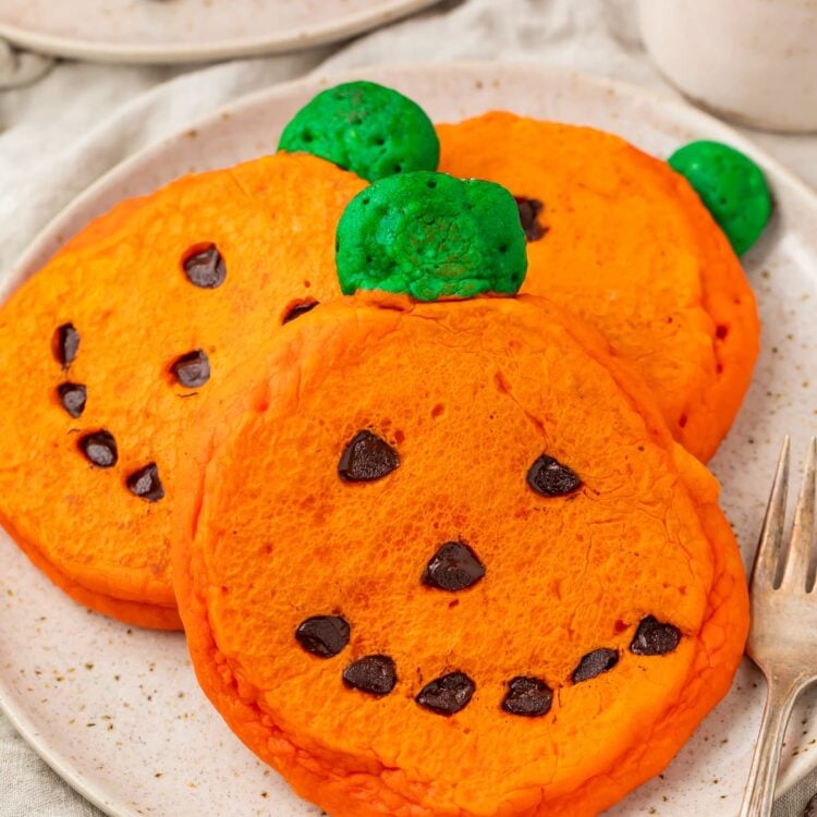 Super cute and easy jack o lantern pancakes on a plate