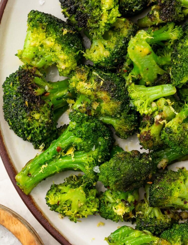 Sauteed broccoli on a white plate