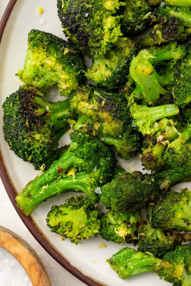 Sauteed broccoli on a white plate