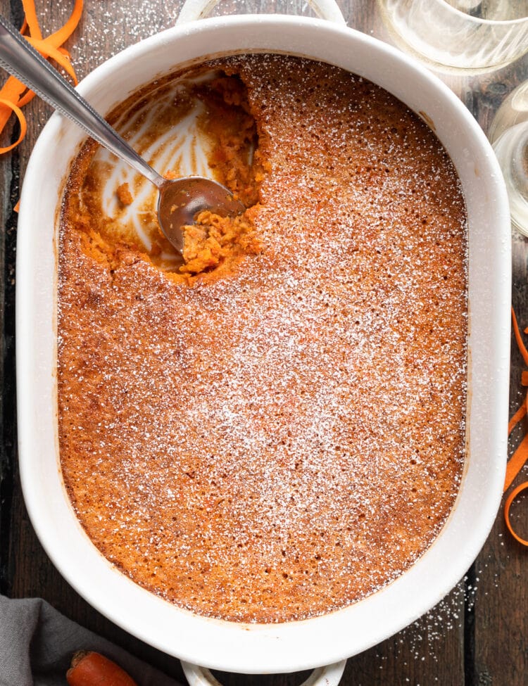 Overhead view of carrot soufflé in a white casserole dish