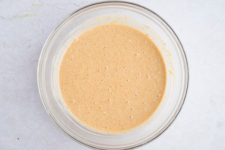 Sweet potato pancake batter in large glass mixing bowl