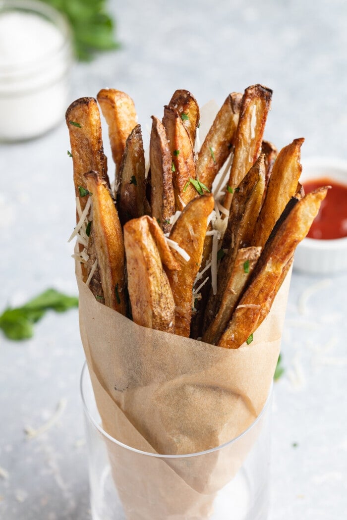 parmesan truffle fries wrapped in parchment paper