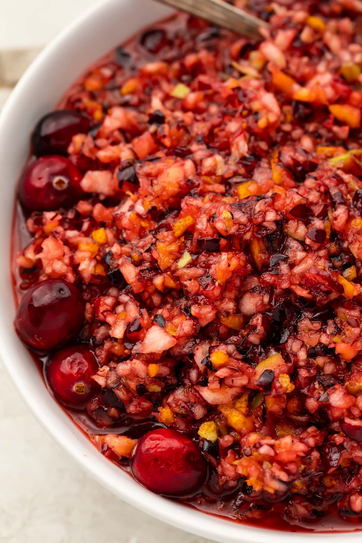 Overhead photo of cranberry relish in a large white bowl.