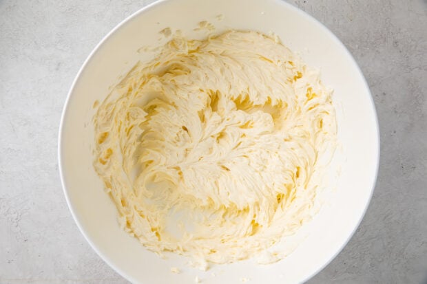 Cream cheese frosting in large bowl