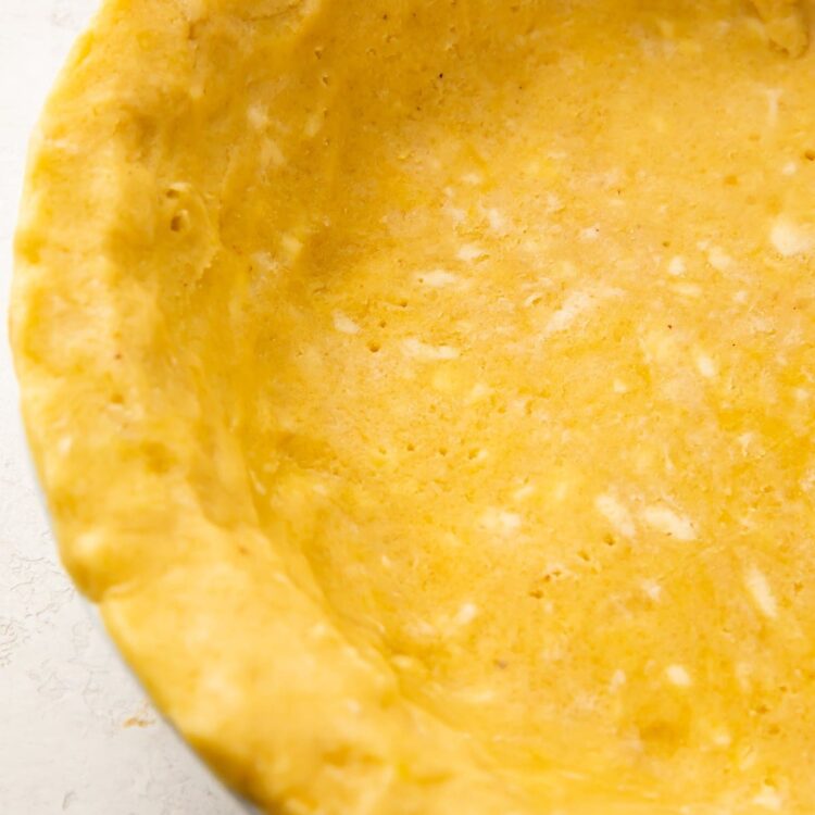 Overhead view of a keto pie crust in a pie dish
