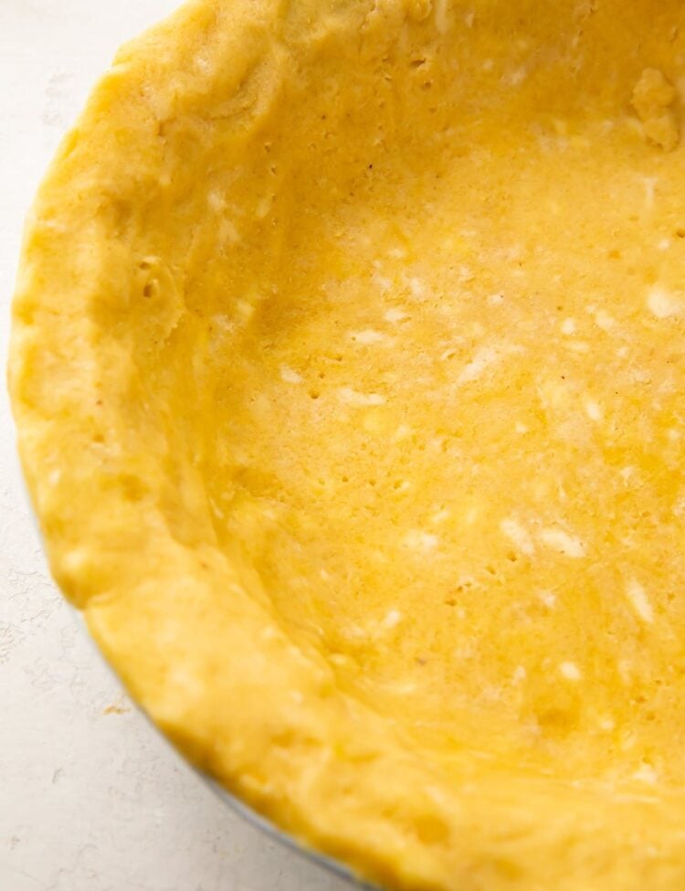Overhead view of a keto pie crust in a pie dish