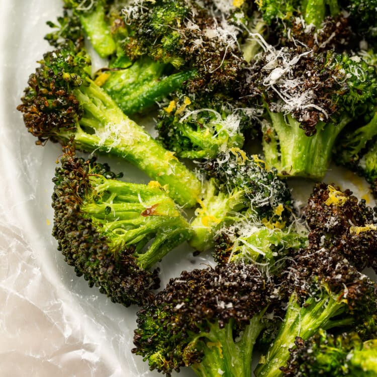 Overhead view of air fryer broccoli on a plate