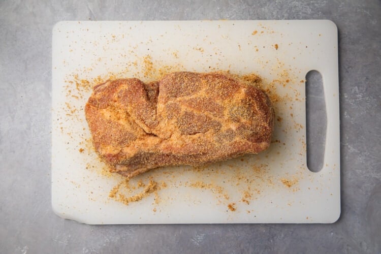 Spice rubbed pork roast on cutting board