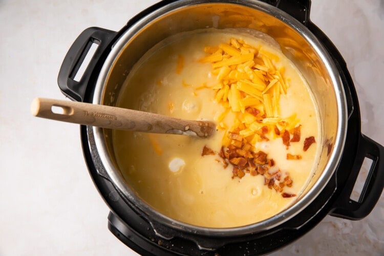 Instant Pot potato soup with shredded cheese and bacon in Instant Pot