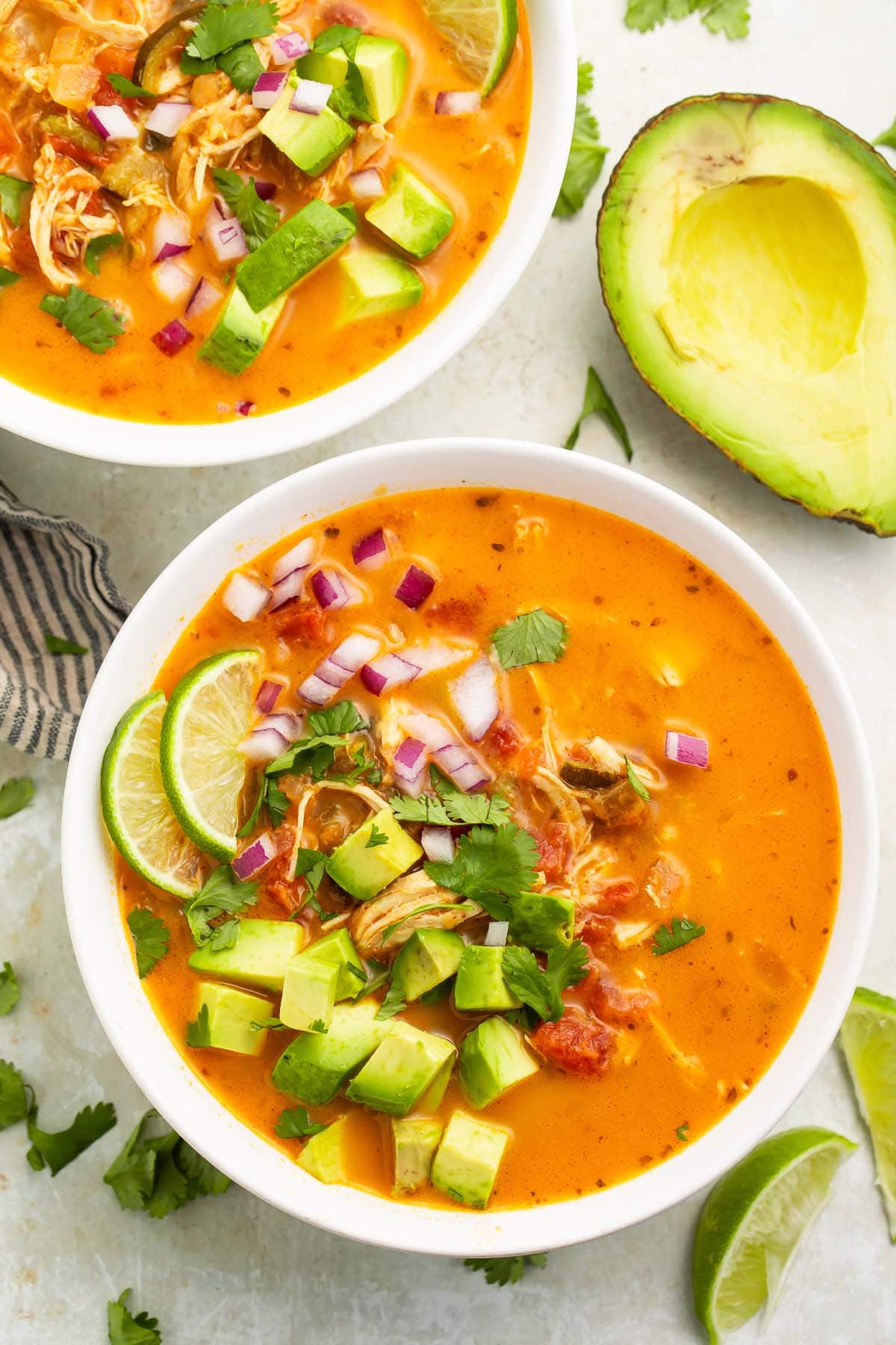 A large white bowl of Whole30 chicken tortilla-less soup on a table.