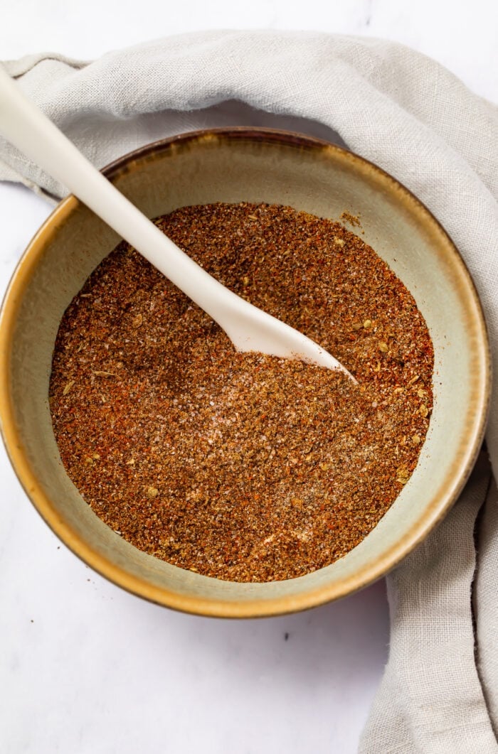 Keto taco seasoning in a bowl with a white spoon