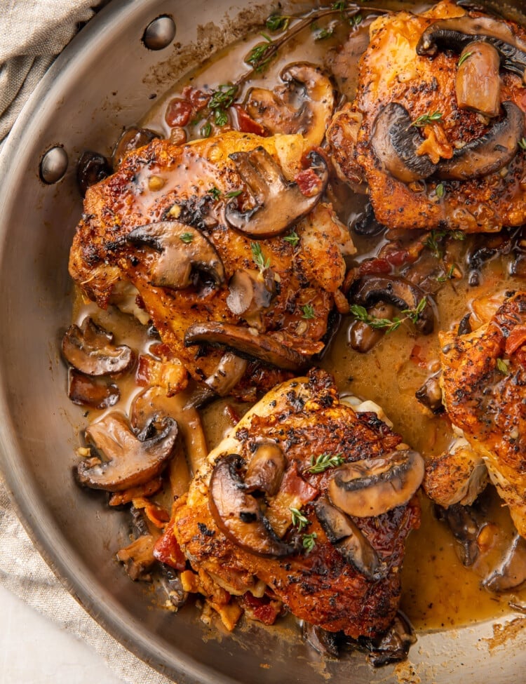 Whole30 Mushroom bacon chicken thighs in a skillet