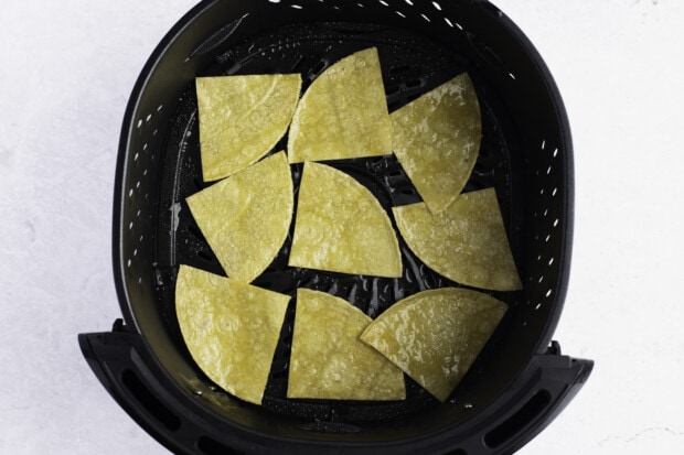 Tortilla chips in air fryer basket