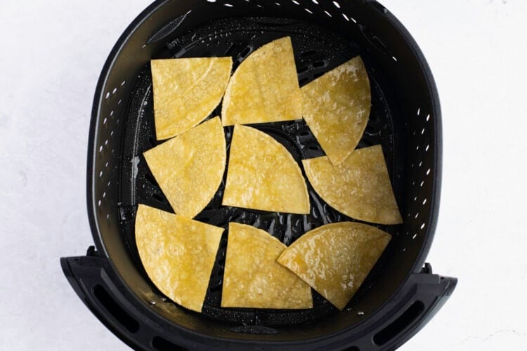 Tortilla chips in air fryer basket