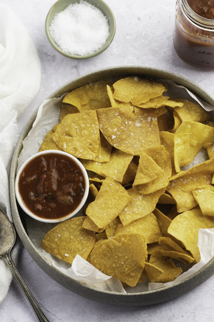 Overhead view of air fryer tortilla chips in a large bowl