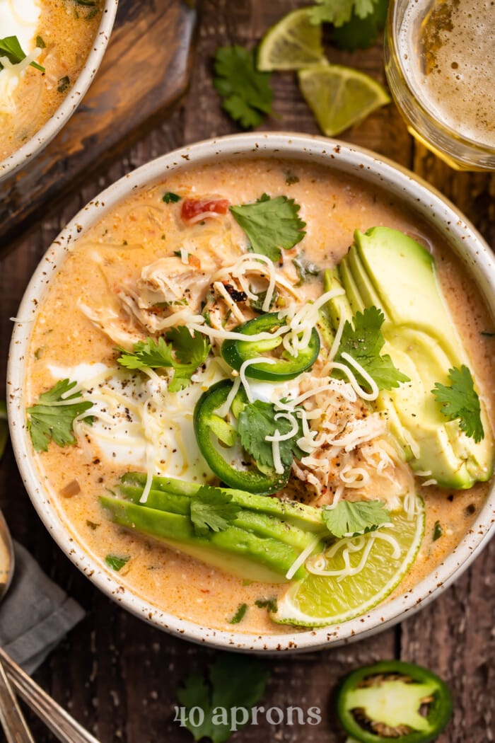 Overhead photo of keto chicken tortilla soup in a rustic bowl