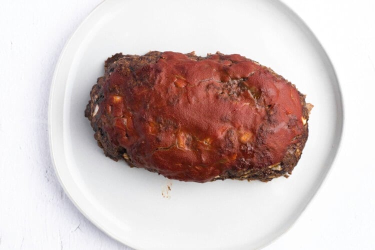 Glazed meatloaf on white plate