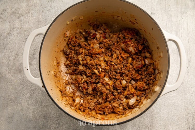 Ground beef, onion, and tomato paste in large pot