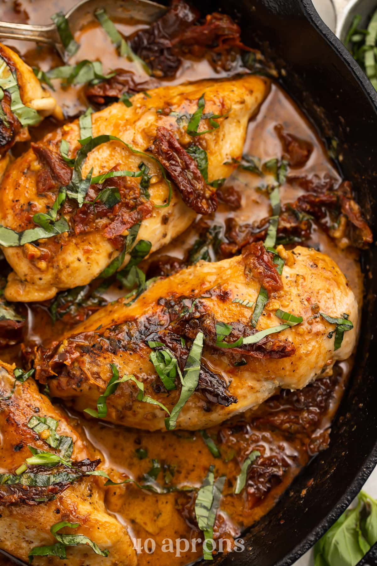 Overhead view of Whole30 Marry Me Chicken in a cast-iron skillet