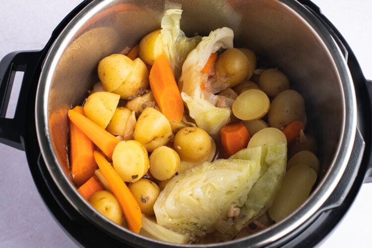 Potatoes, carrots, and onions in Instant Pot.