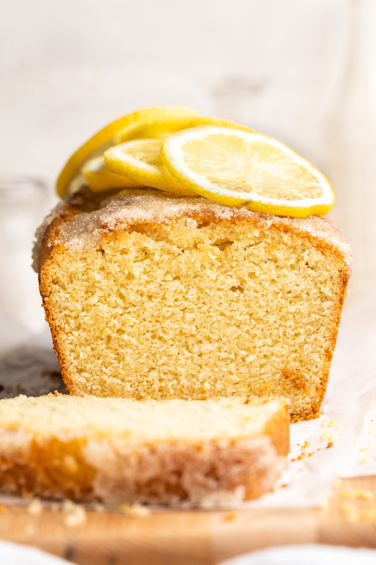Close-up of lemon drizzle cake taken from end to show inside texture of cake.