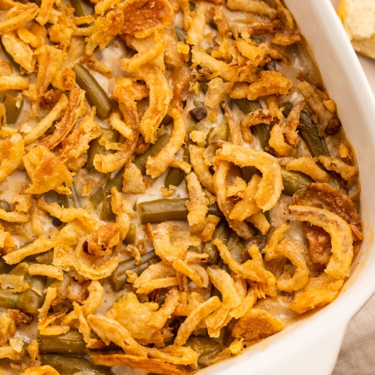 Close up, overhead view of an angled casserole dish holding a make ahead green bean casserole.