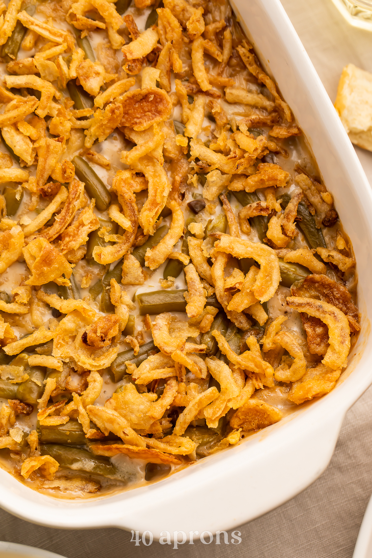 Close up, overhead view of an angled casserole dish holding a make ahead green bean casserole.