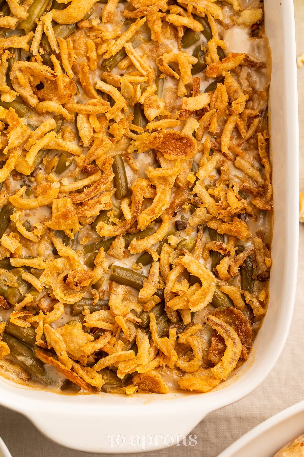 Overhead view of a large rounded rectangular casserole dish holding a make-ahead green bean casserole.