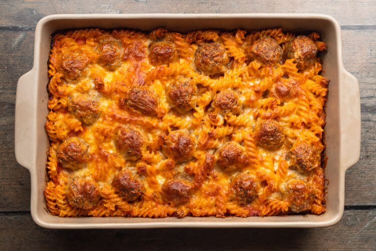 Overhead view of meatball casserole topped with mozzarella.
