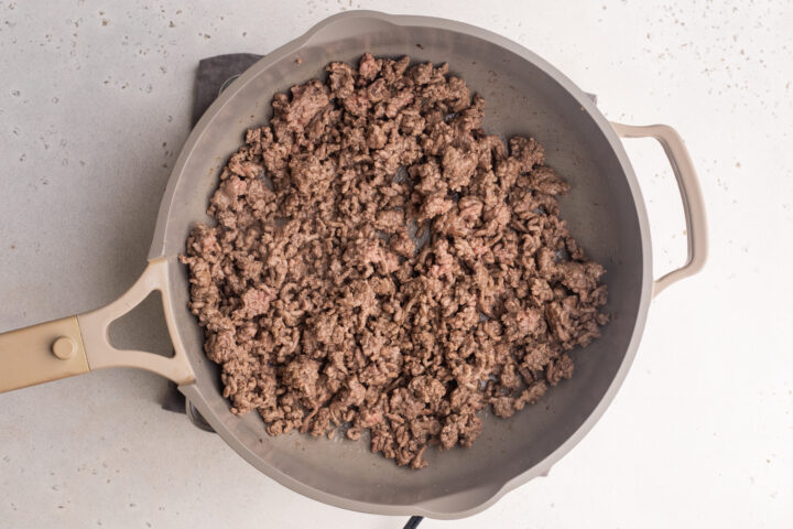Ground beef in a large skillet.