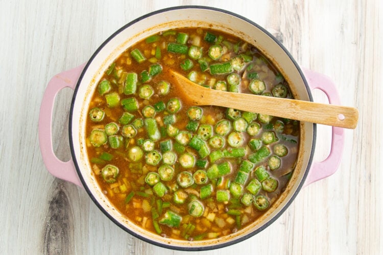 Cajun 15-bean vegetarian gumbo with 2 cups of okra and plenty of spices in a large heavy-bottomed pot with two handles.