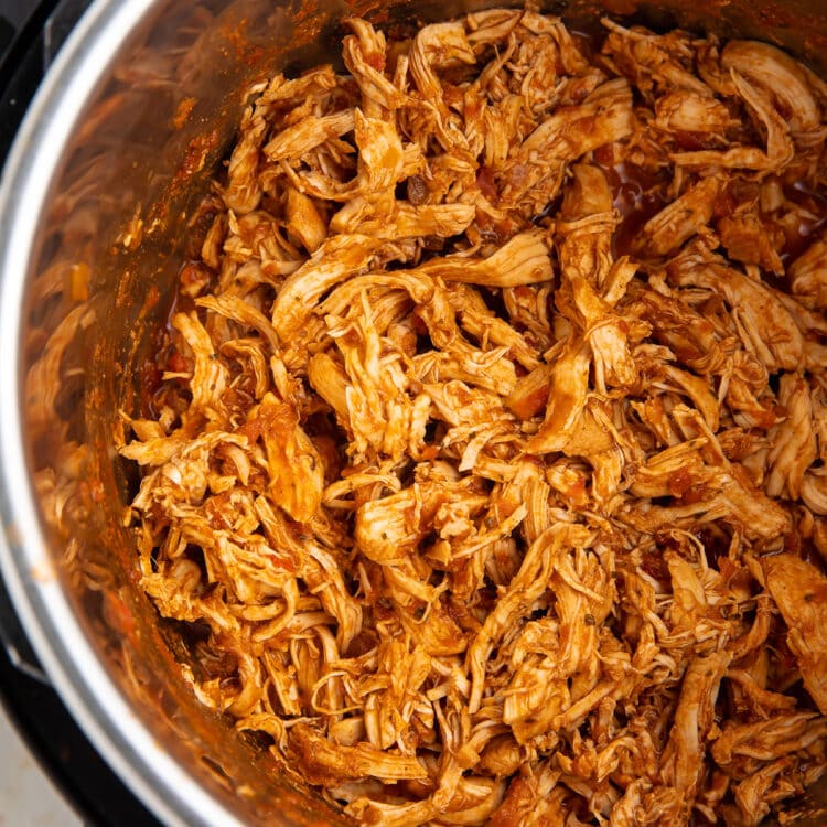 Shredded salsa chicken in an Instant Pot.