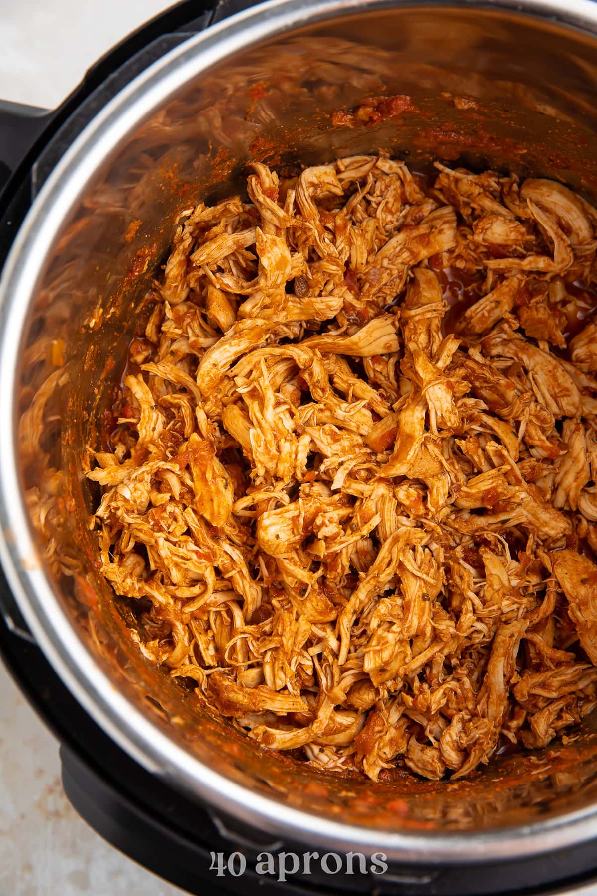 Shredded salsa chicken in an Instant Pot.