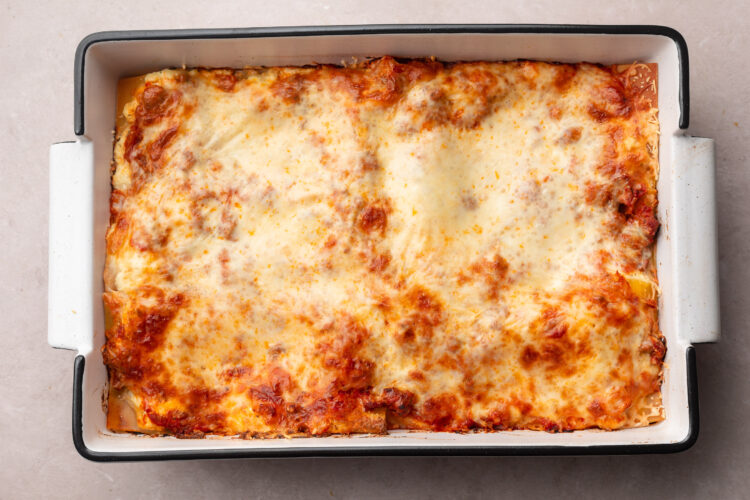 Fully baked gluten-free lasagna with melted, bubbly mozzarella cheese and red marinara sauce.