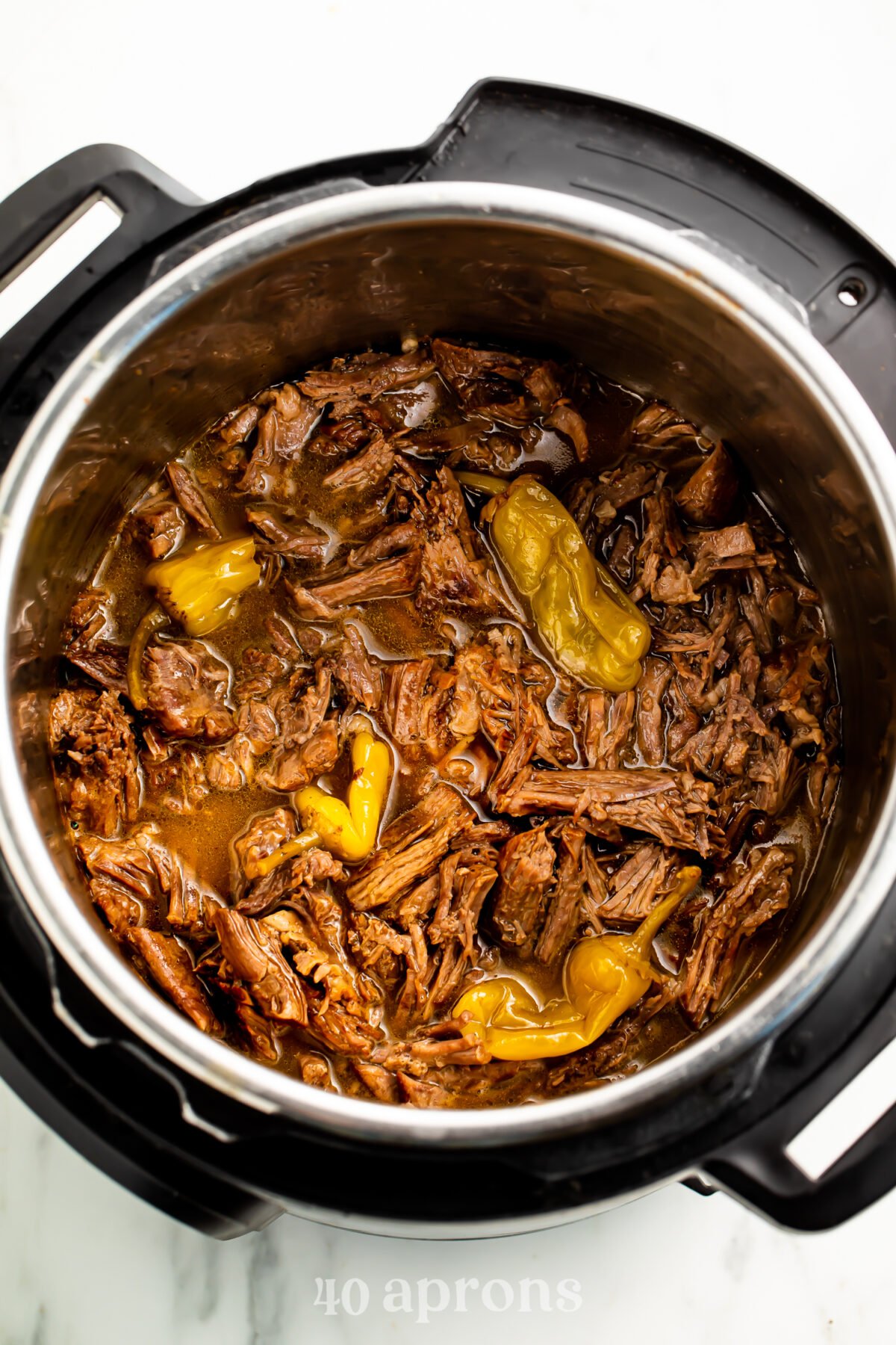 Overhead, top-down look at Instant Pot Mississippi pot roast in the Instant Pot.