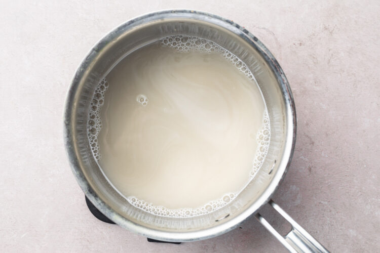 Dashi powder and water in a small silver saucepan.